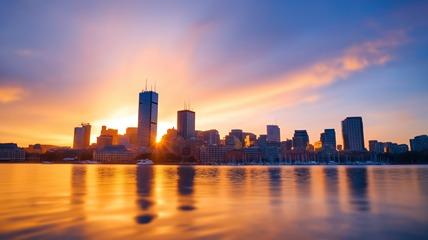 Boston skyline with sun rising in the background
